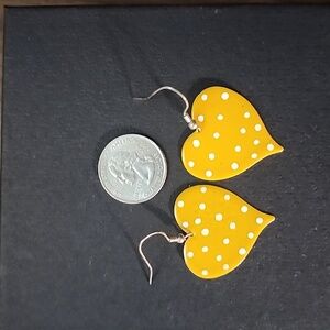 Yellow large polka dot heart earrings.